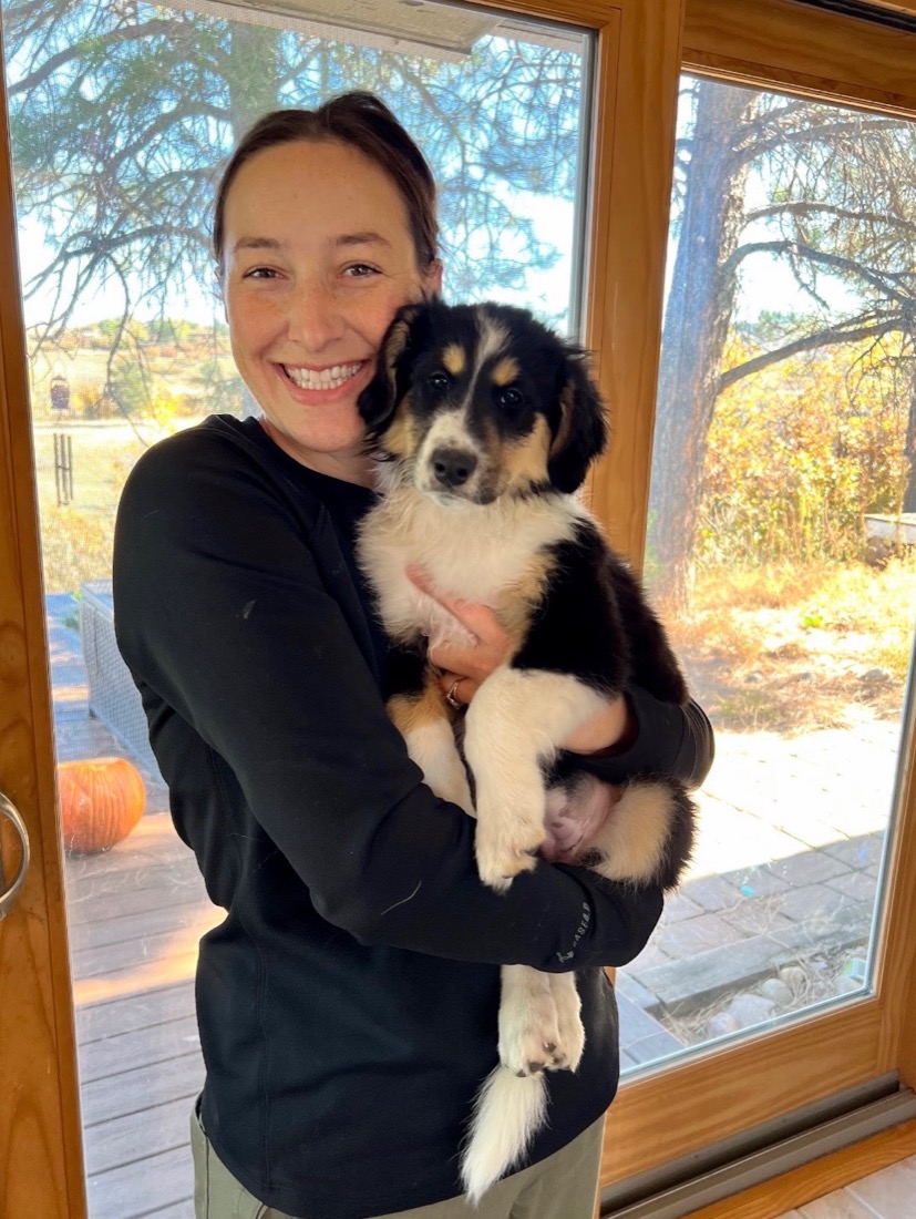 Sarah Whitman holding a tri-color collie puppy
